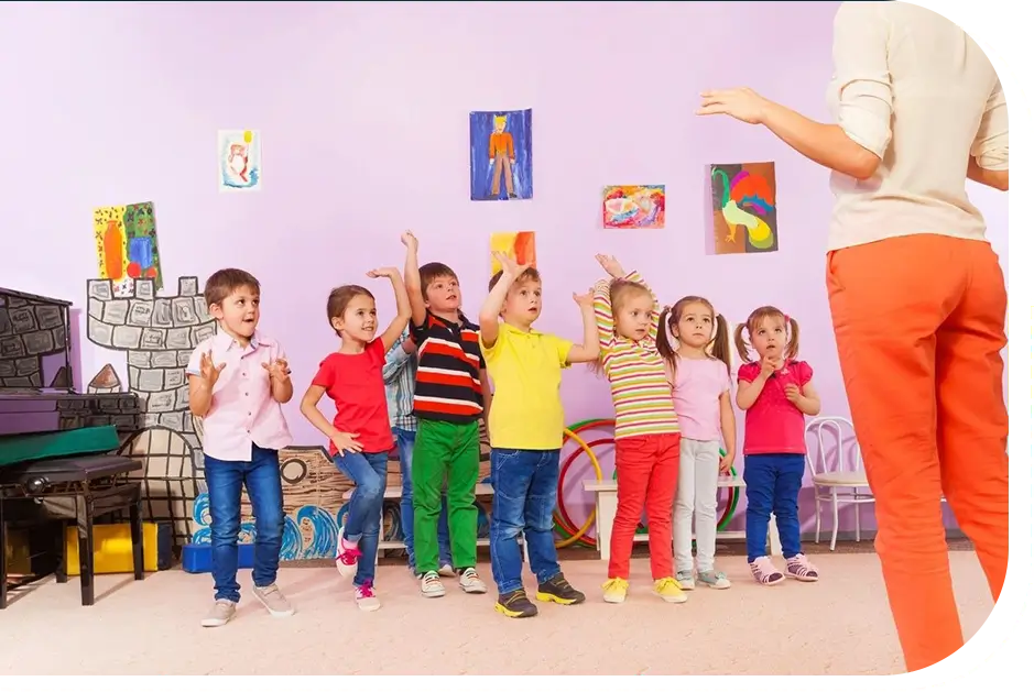 A group of children standing in front of an adult.